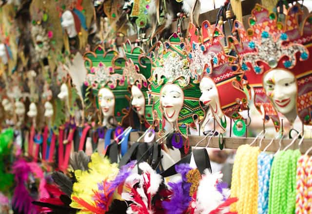 colorful masks and hair accessories with feathers and rhinestones