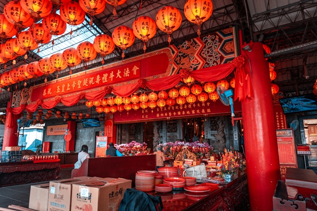 red lanterns, plates, and flowers are set up for a celebration in Taipei