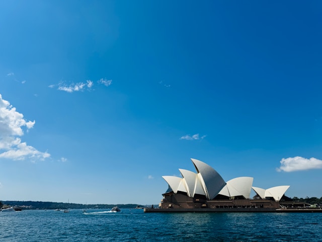 the Sydney Oper House from across the water on a clear blue day
