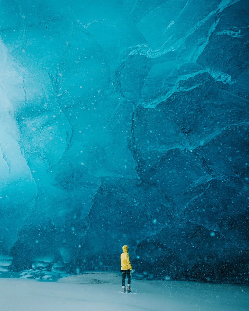 Bree stands in front of an ice cave in Iceland